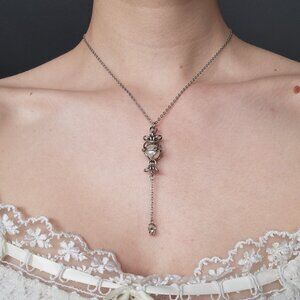 White pearl and silver rosary necklace with a small silver chain